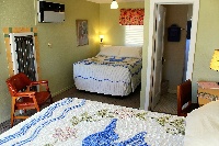 Some rooms at the Blue Swallow have two comfortable beds.