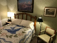 Each room features unique, authentic period decor, including chenille bedspreads, vintage lighting, and rotary-dial phones from 1939.