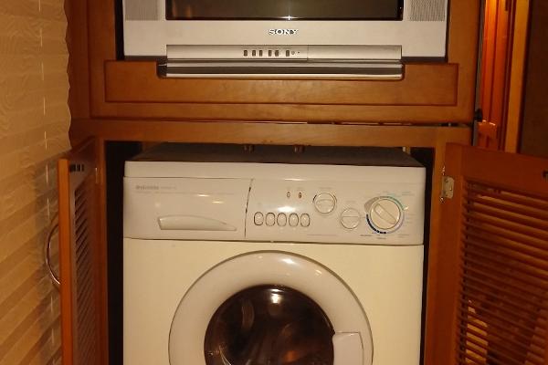 TV and Washer/Dryer Combo in Master Bedroom