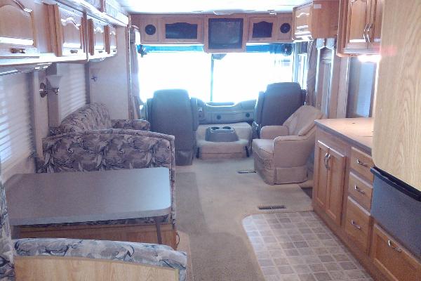 Large living space with built in TV/Entertainment area above driver and passenger area