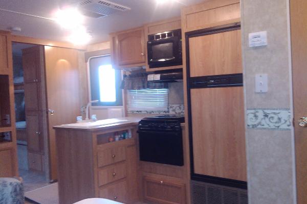 Full Kitchen with double sink, stove/oven, microwave, refrigerator and freezer