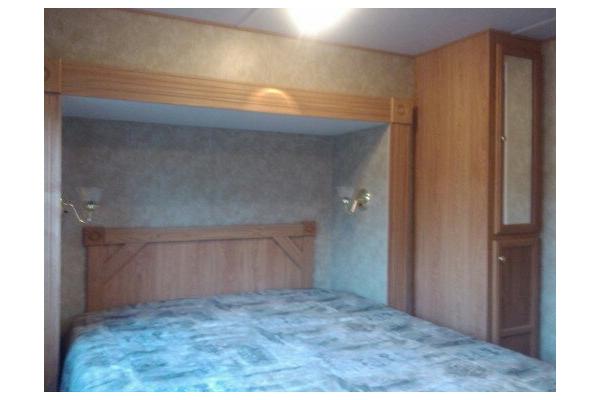 Seperate Mater Bedroom Suite with Queen Island Master Bed, and many cabinets & drawers for storage