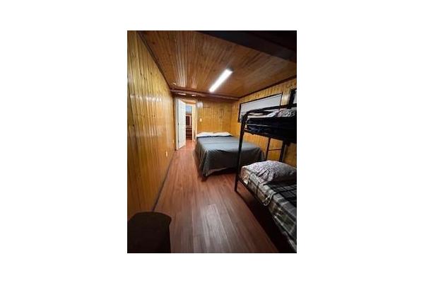 1st bedroom has queen bed and bunks