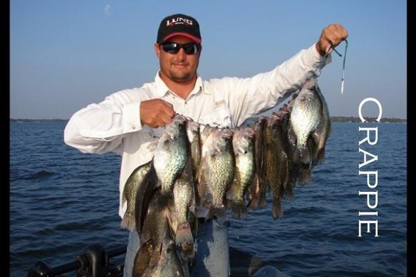 Chuck Rollins on Cedar Creek Lake with a stringer of Crappie