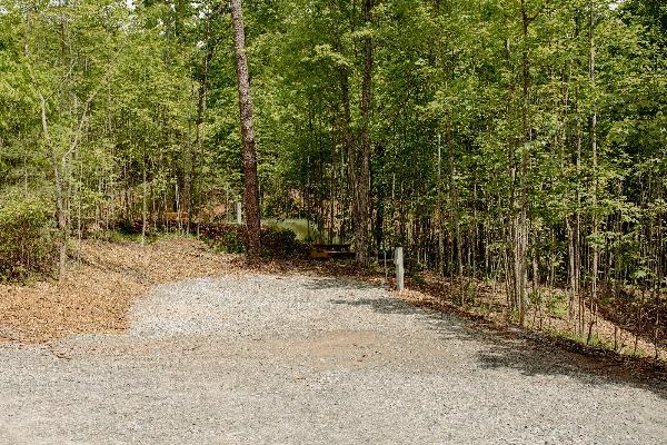 Site #395- 50' L back-in site, FHU, picnic table and fire ring W/ swivel cooking grate.