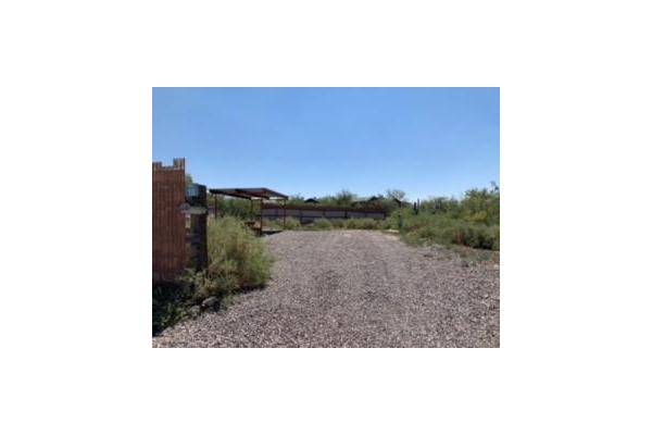 inside a fenced area with picnic table