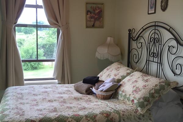 Located on our second story with peeks of Lake Erie, this romantic room was named after the city Christie fell in love with Cliff. It has a closet fo hanging clothes and two windows for fresh breezes.