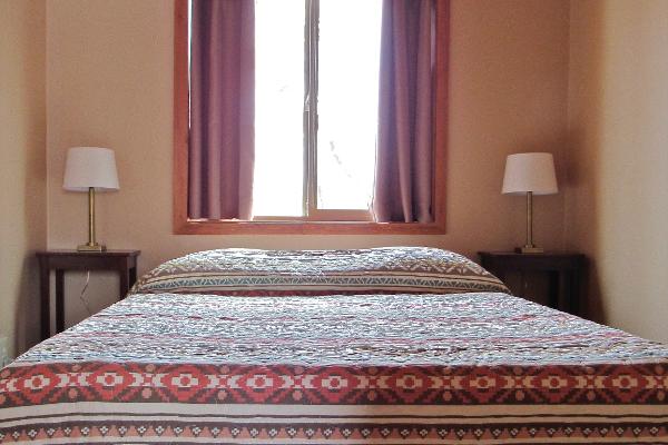 Each bedroom features a plush queen sized bed.