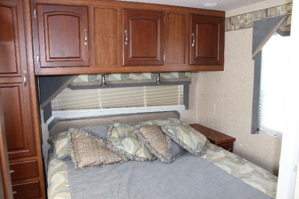Masterbedroom with Queen Island bed with lots of storage & closet space